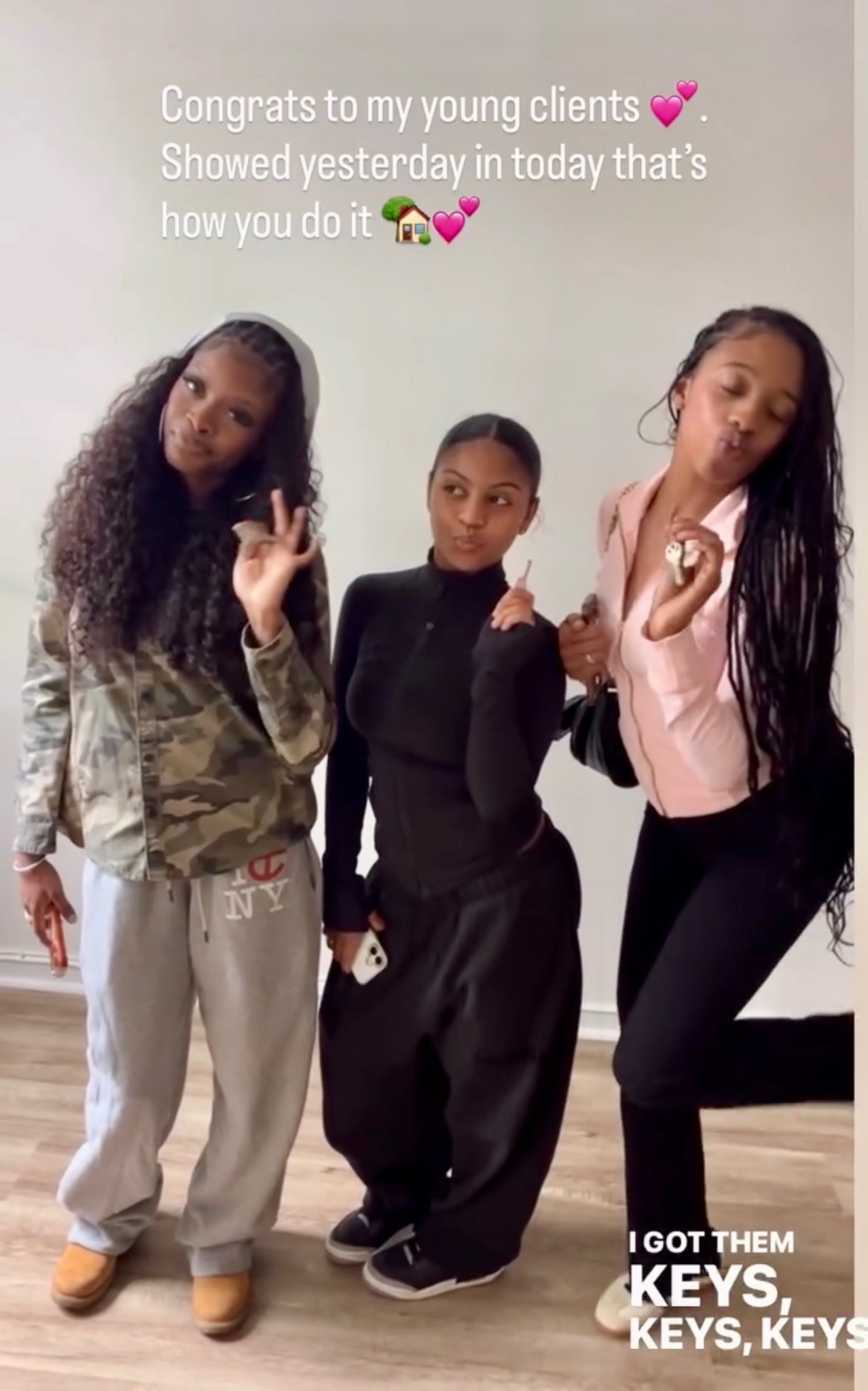 Three people posing together in an apartment, with a congratulations message and a caption about getting keys